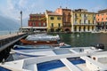 Boats parked in small harbor in Malcesine, Italy located at lake Garda Royalty Free Stock Photo