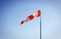 Boats parking and aircraft - Wind direction indicator. East Royalty Free Stock Photo