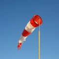 Boats parking and aircraft - Wind direction indicator Royalty Free Stock Photo