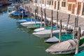 boats parking at the small pier in Burano, Venice