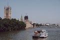 Boats passing by Big Ben in scaffolding, London, UK Royalty Free Stock Photo