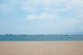 Boats in Pattaya sea, beach, and urban city with blue sky for travel background. Chonburi