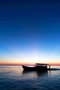 Boats on peaceful ocean at sunset Royalty Free Stock Photo