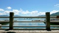 Boats, pier, lake and white cloud in sunny day