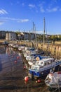 Boats at a pier in low tide at south queensferry in Scotland