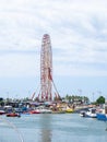 Boats and boats in the port of Batumi. Ferris wheel in the port. Ships in the harbor. Resort place. Transport for recreation on