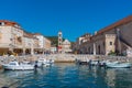 Boats at port of Hvar with cathedral of Saint Stephan in background, Croatia