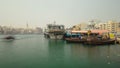 Boats at Port Saeed along Deira's shore of Dubai Creek, UAE. Timelapse