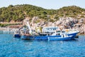 Boats in port at small fishing village of Kamiros Skala. Rhodes, Greece