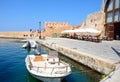Boats and restaurants in the harbour, Chania.