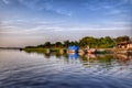Boats resting on the bank of a river Royalty Free Stock Photo