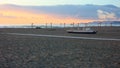 Boats resting on the beach in their parking area waiting for the summer