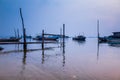 Early morning sketch by the foggy lake with boats Royalty Free Stock Photo