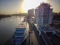 Boats on the river Don and city panorama at sunset. Rostov-on-Don, Russia. Aerial view Royalty Free Stock Photo