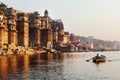 Boats in a row on Ganges River in Varanasi.The famous Ghat s of the city during sunrise.