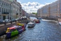 Boats sailing along Moyka river, St. Petersburg, Russia