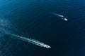 Boats sailing through the blue sea in Alcudia, in Mallorca, Spain. Royalty Free Stock Photo