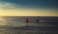 Boats sailing on the sea with the beautiful view of sunset in the background Royalty Free Stock Photo