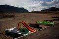 Boats are seen on scorched earth and earth clods on dry land caused by drought and lack of rain due to climate change. Concept of Royalty Free Stock Photo