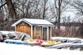 Boats and Shed Covered in Snow