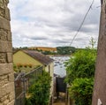 Boats and ships moored in a small port, in the background coastal town, fishing industry and tourism Royalty Free Stock Photo