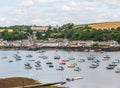 Boats and ships moored in a small port, in the background coastal town, fishing industry and tourism Royalty Free Stock Photo