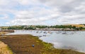 Boats and ships moored in a small port, in the background coastal town, fishing industry and tourism Royalty Free Stock Photo