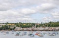 Boats and ships moored in a small port, in the background coastal town, fishing industry and tourism Royalty Free Stock Photo