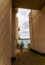 Boats and ships moored in a small port, in the background coastal town, fishing industry and tourism Royalty Free Stock Photo