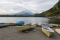 boats at Shoji lake shore with mount Fuji or Fujisan background Royalty Free Stock Photo