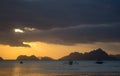 Boats silhouette in the sea on sunset and isles background. Traditional Philippines fishing boat at sunset. Scenic sunset on sea. Royalty Free Stock Photo