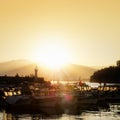 People at harbor during sunset Royalty Free Stock Photo