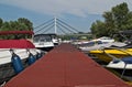Boats sitting at Danube marina dock and bridge in background