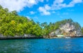 Boats and a Small Jetty off a Tropical Island Royalty Free Stock Photo