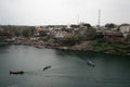 Boats and a small pedestrian bridge on the ghats of narmada river in the holy city of omkareshwar madhya pradesh India