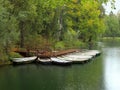 Boats at the small pier in the rain in the beginning of autumn