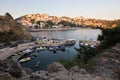 Boats at the small port in adriatic resort in old Ulcinj town during sunset