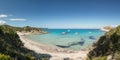 Boats in a small rocky cove with sandy beach in Corsica Royalty Free Stock Photo