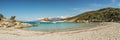 Boats in a small rocky cove with sandy beach in Corsica Royalty Free Stock Photo