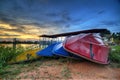 Boats stack at the river bank with sunset background Royalty Free Stock Photo