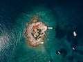Boats stand near the island of Otocic Gospa. Montenegro. Drone