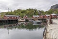 Boats at stilt quay in inlet harbor, Nusfjord, Lofoten, Norway