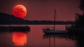 boats at sunset A red moon over water, representing the passion and the emotion of water. The moon is fiery and orange