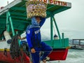 Boats supply 24/7 all kind of stuff to compensate the lack of resources of the island. Here the crew unloading the goods