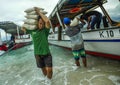 Boats supply 24/7 all kind of stuff to compensate the lack of resources of the island. Here the crew unloading rice