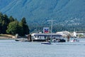 Boats on the surface of the sea against green-covered hills in Vancouver, Canada Royalty Free Stock Photo