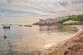 Boats in Swanage Bay Dorset on a bright colourful cloud sheet morning