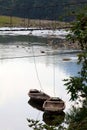 Boats tied to old bridge