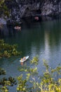 Boats with tourists float on the lake of the Great Marble Canyon in the Republic of Karelia in Russia