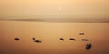 Boats with tourists at Ganga river - vintage filter. Sunrise in Varanasi. Royalty Free Stock Photo